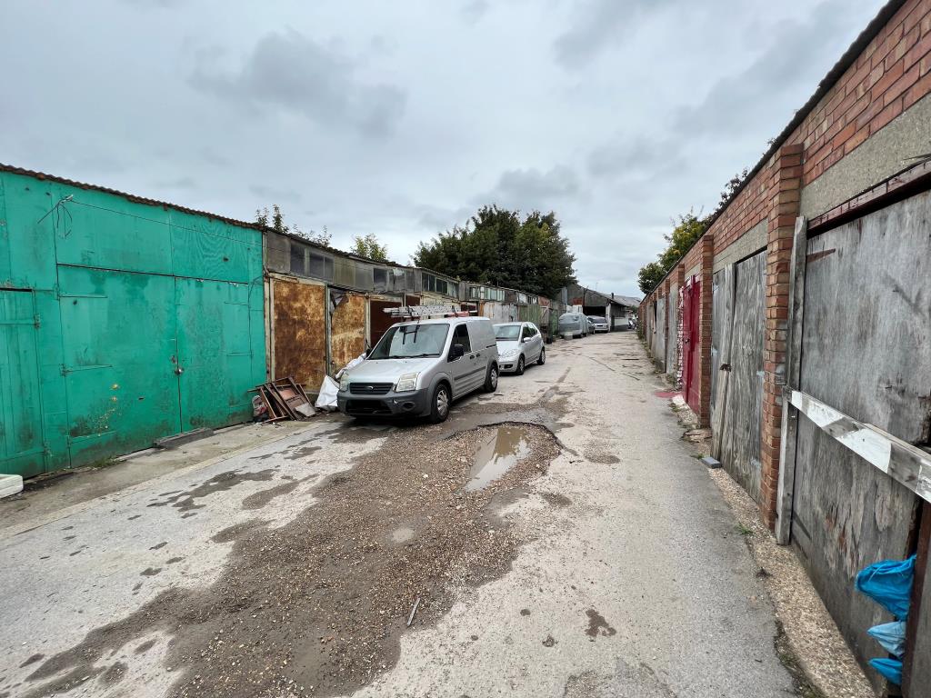 Lot: 118 - HALF ACRE SITE COMPRISING CAR SALES LOT CAR REPAIR GARAGE AND OVER 40 LOCK-UP STORES - 